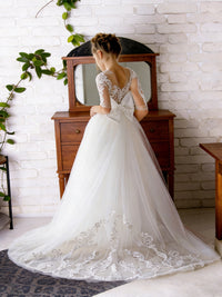 Lace-Embellished Sheer Sleeve Round Neck Flower Girl Dress with Tulle Floor-Length Train Skirt and Back Bow for Weddings and Formal Occasions